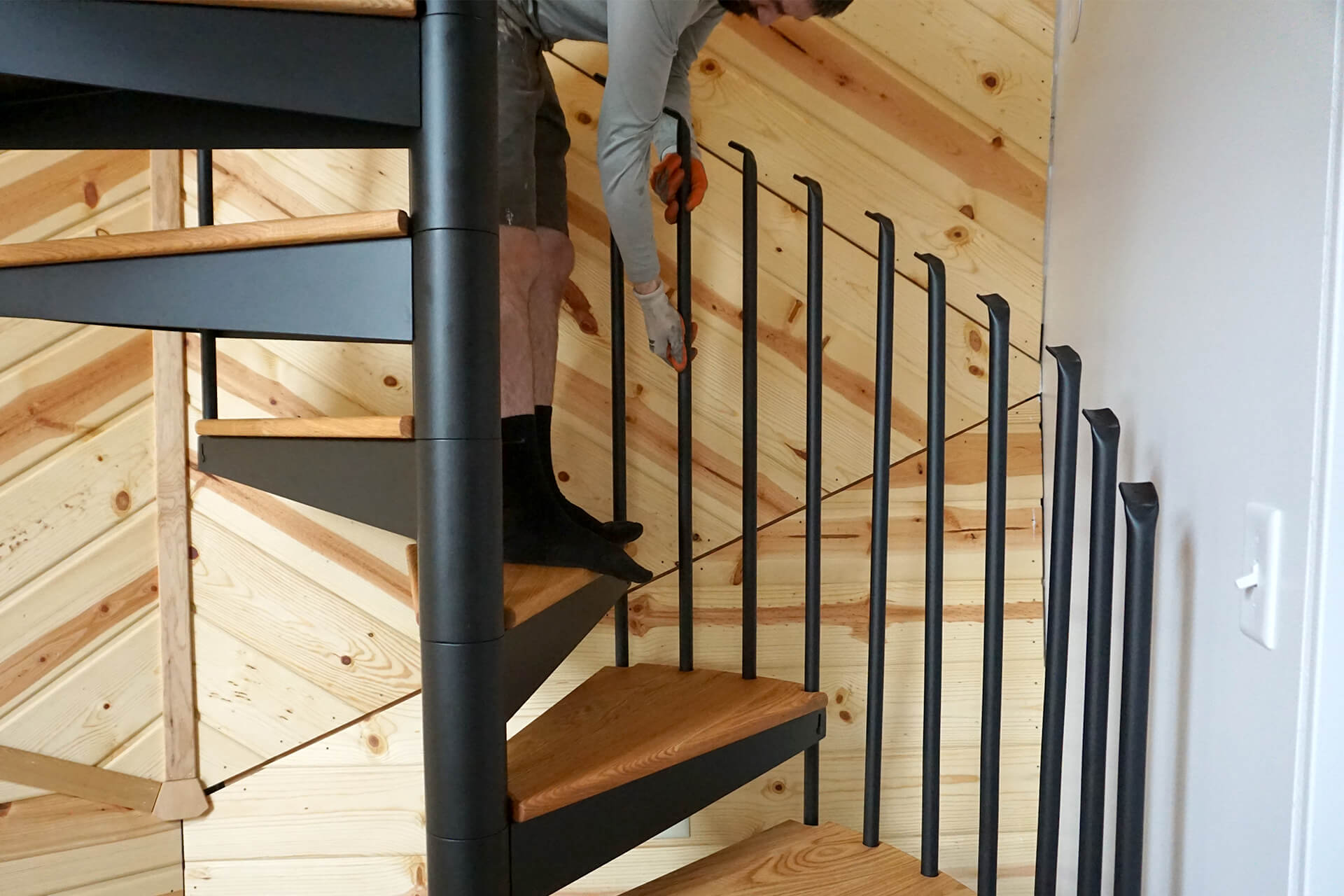 Installing the balusters for the spiral staircase.