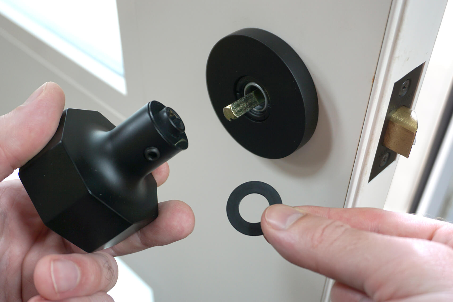 Installing the front door knob.