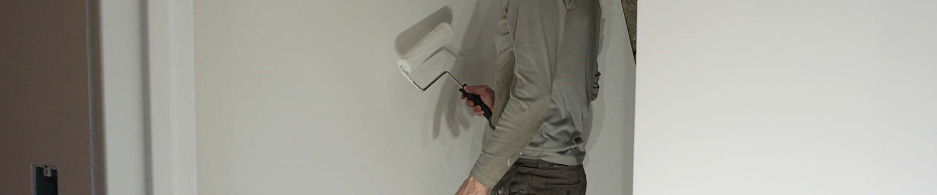 A close-up view of painting the Mini Dome interior walls.